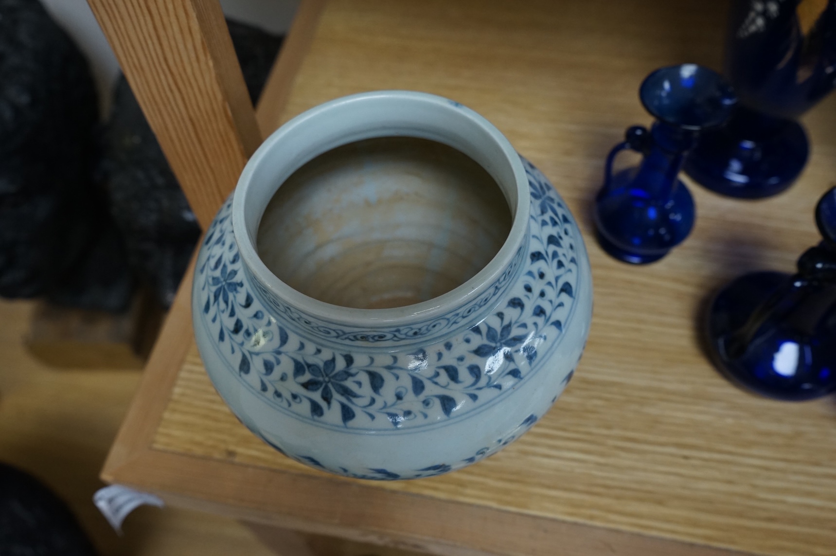 A Chinese blue and white squat vase with floral decoration, 16cm high